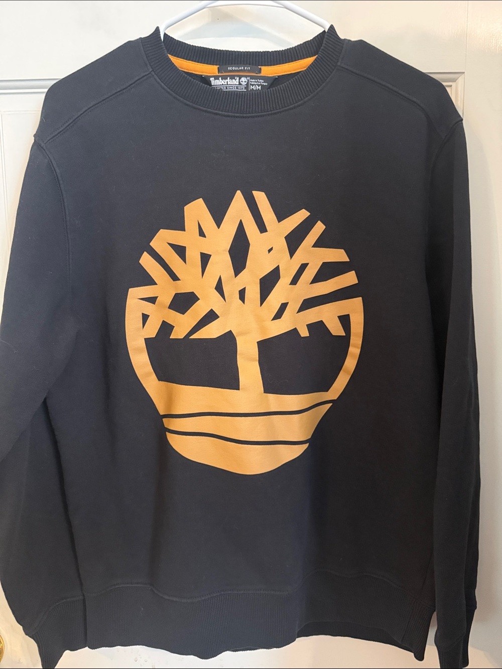 Timberland Black Crewneck with Bold Gold Tree Graphic
